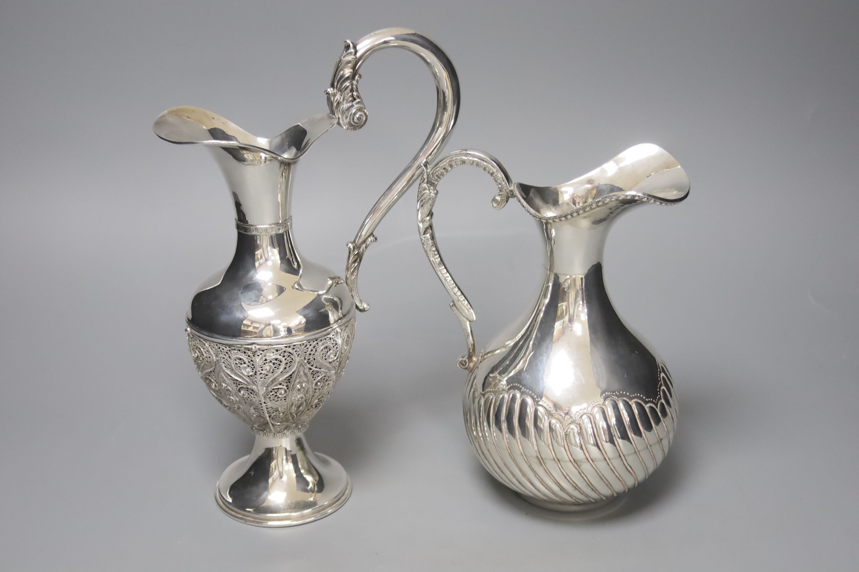 Two silver plated water jugs, height 25cm